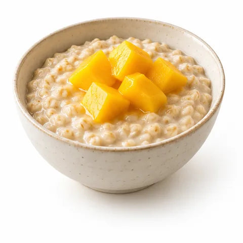 Bowl of oatmeal topped with mango